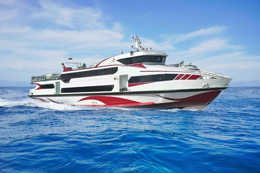 A large white and red speedboat on the ocean. 5