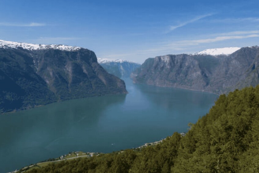 A fjord with steep cliffs and a calm lake. 2