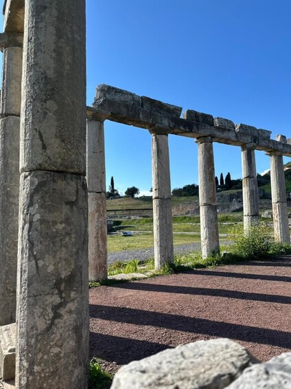 Ancient stone columns and a clear blue sky. 2