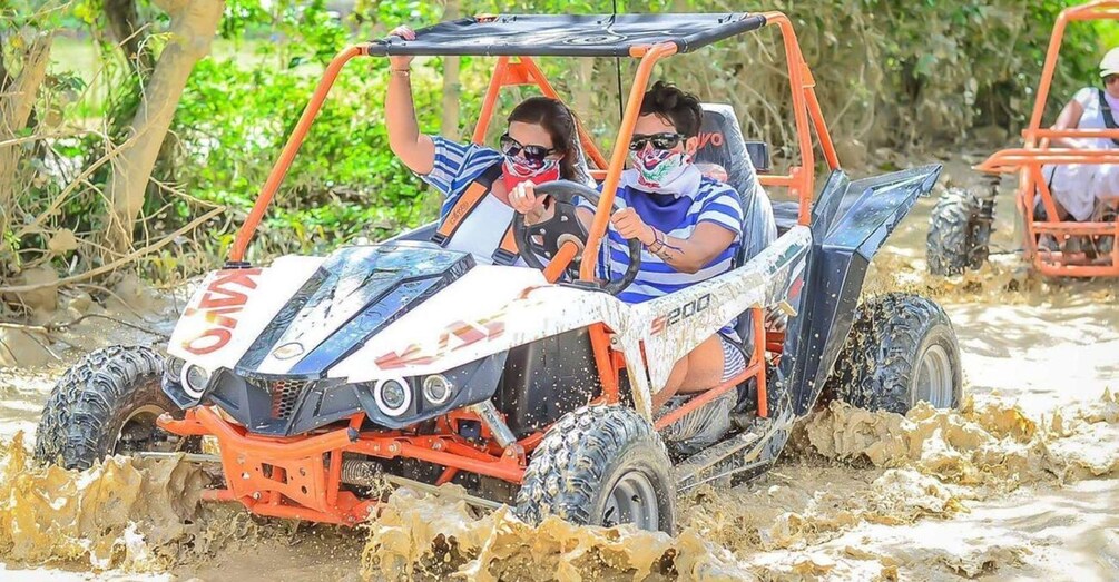 A vehicle navigating through a muddy terrain. 2