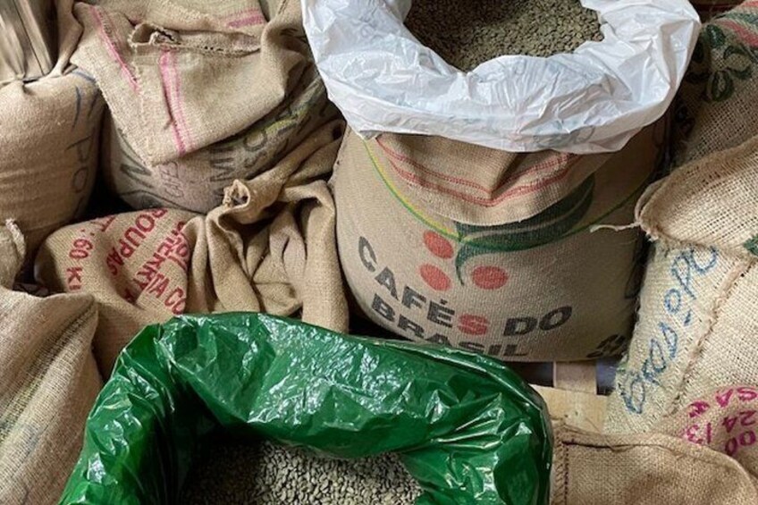 Burlap sacks with printed text and a green plastic bag. 2