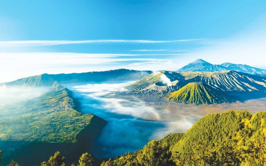 A mountainous landscape with a valley, forested areas, and a river. 2