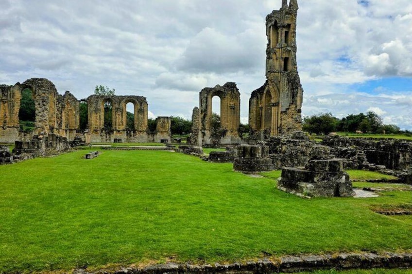 Ancient ruins with arches and a tower. 2
