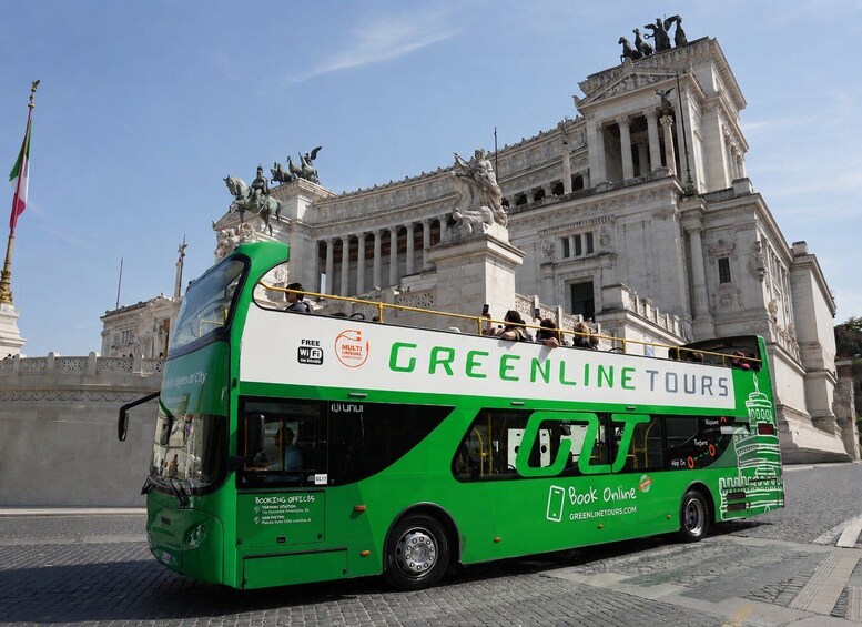 A green double-decker bus with 'GREENLINE TOURS' written on it, parked in front of a large historical building with statues. 4