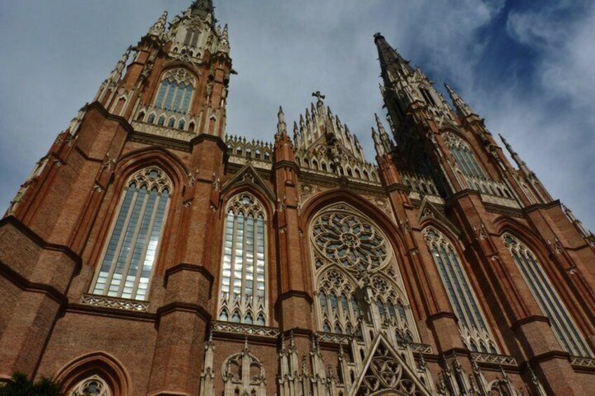 A large, ornate cathedral with tall spires and intricate window designs. 1