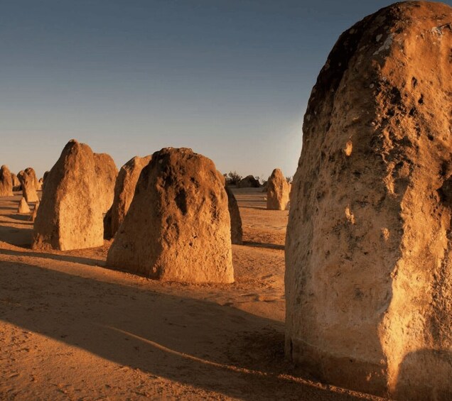A desert landscape with large, rounded rock formations. 4