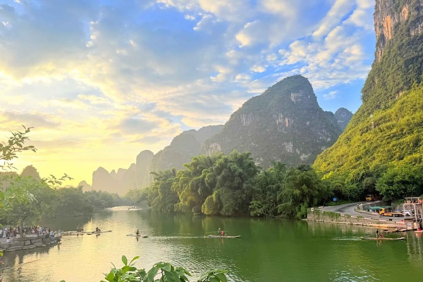 A river with boats, surrounded by lush greenery and mountains. 2