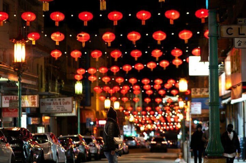 A street lined with shops and red lanterns. 5