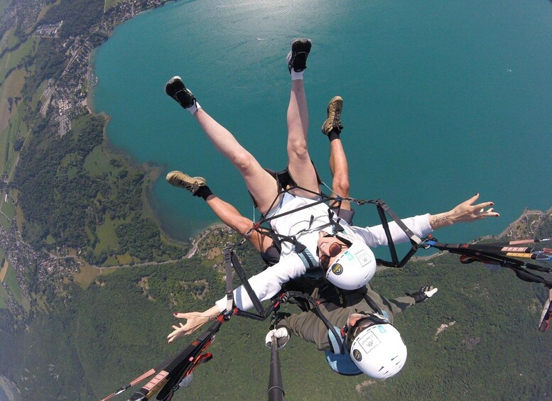 A person skydiving with a parachute, surrounded by a coastal landscape and greenery. 1