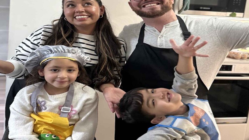 A family of four in a kitchen. 3