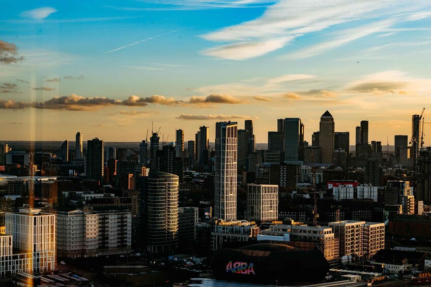A city skyline with numerous high-rise buildings and a large stadium. 4