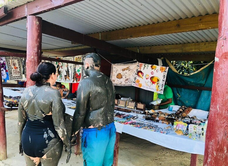 A market stall with various items for sale, including jewelry and souvenirs. 2