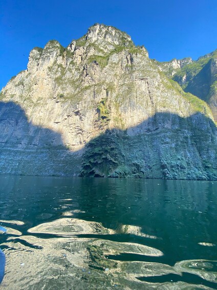 A mountain with a lake in the foreground. 5