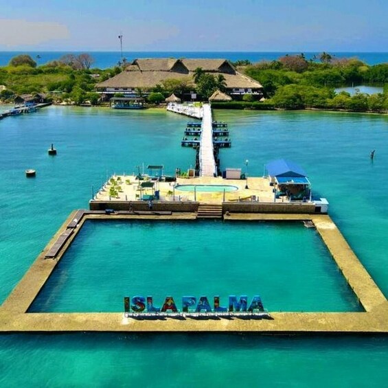 A resort with a pool, overwater bungalows, and a pier extending into the water. 3