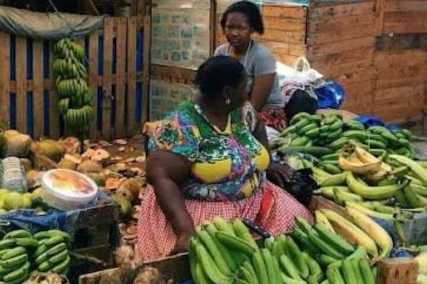 A market scene with bananas and coconuts. 5