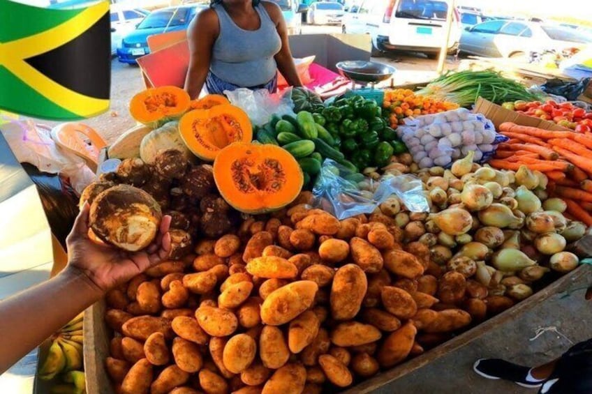 A market stall with various vegetables and fruits, including carrots, onions, and a halved pumpkin. 4