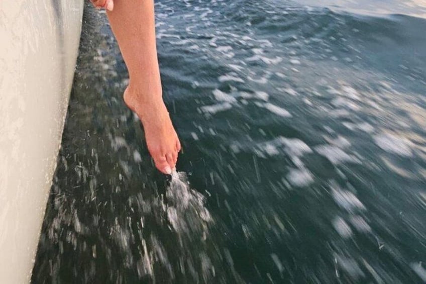 A person's foot in the water, indicating a boat or ship. 5