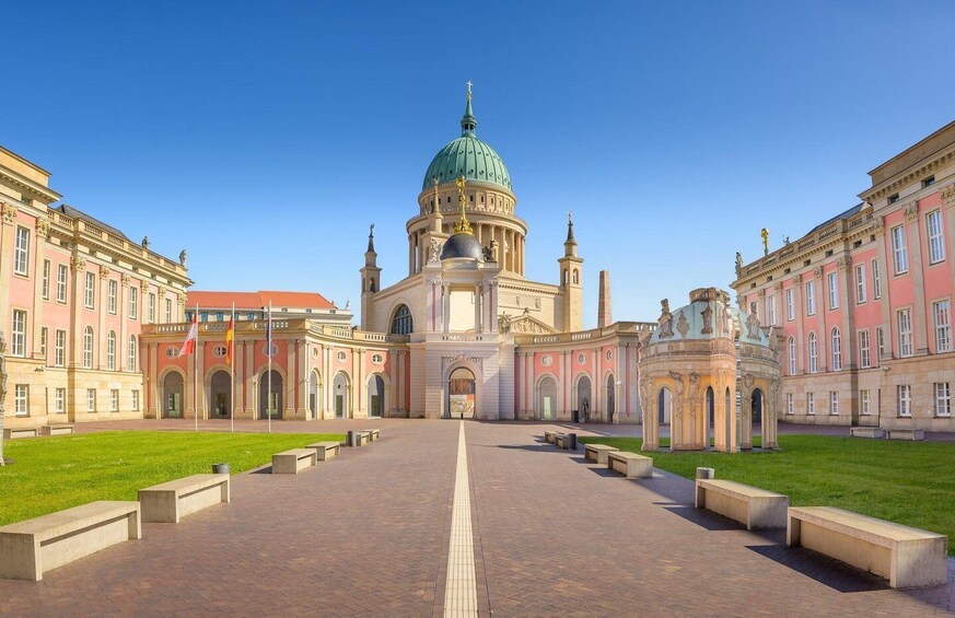 A grand building with a large dome and a central courtyard. 1