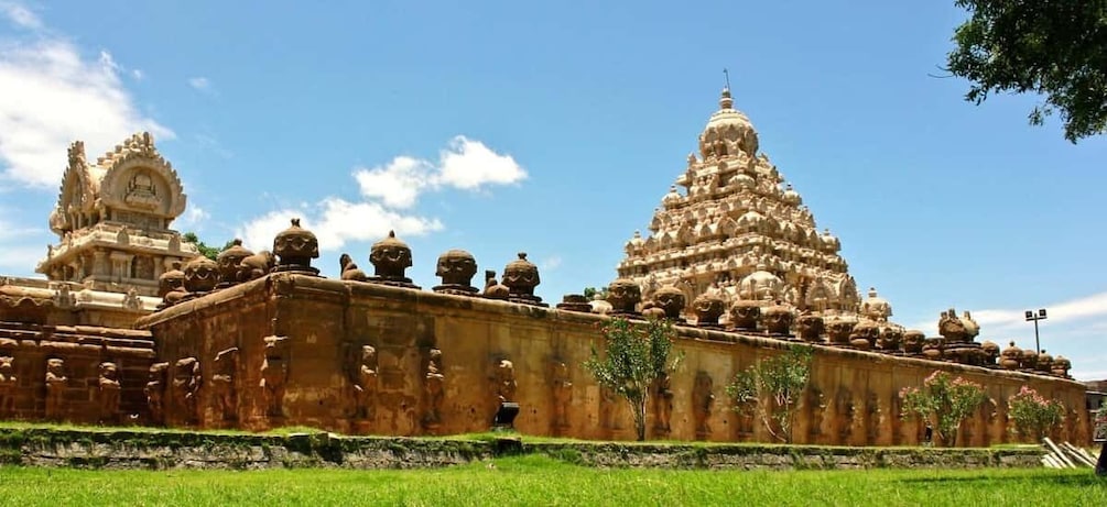 A temple with intricate architecture and a large central tower. 1
