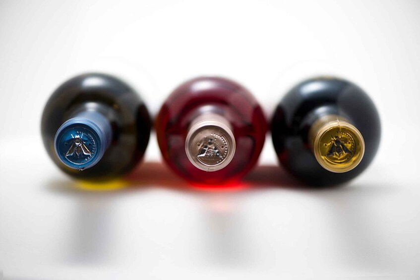 Three bottles with different colored caps. 1