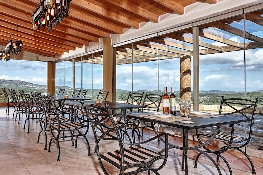 An outdoor dining area with a view of the countryside. 2