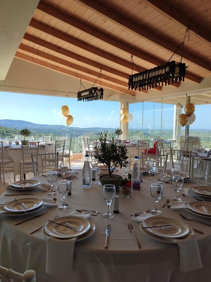 A table set for a meal with a view of the mountains. 4