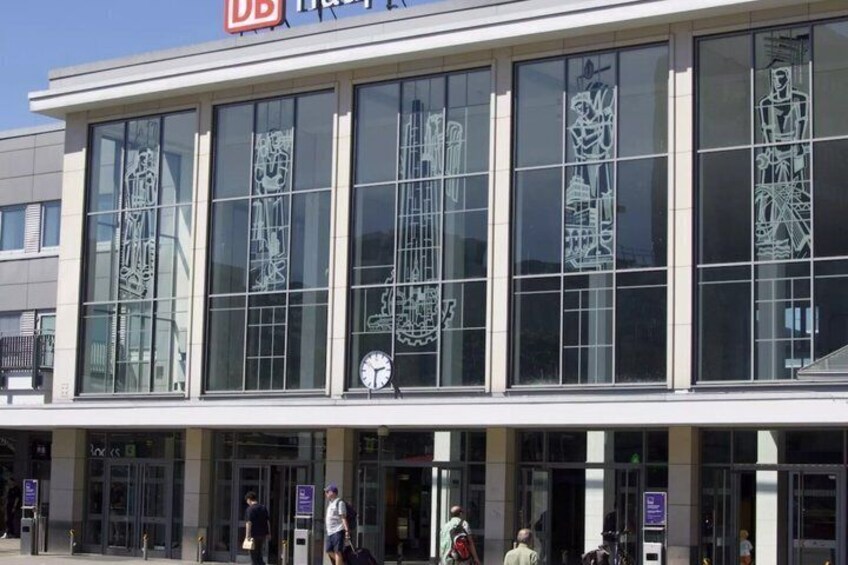 A building with large windows and a clock. 3