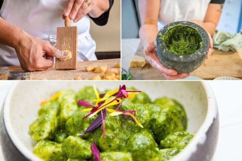 A person using a wooden tool on food, a bowl of green sauce, and a dish of food with green sauce and purple garnish. 1