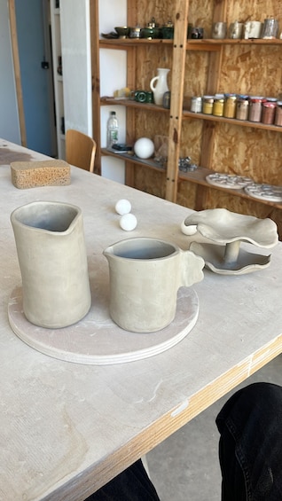 Ceramic pottery on a workbench. 4