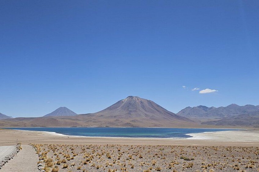 A mountain, a lake, and a desert landscape. 2