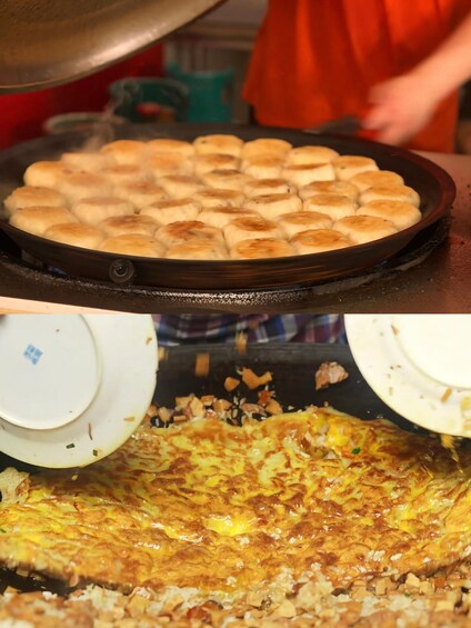 A cooking scene with a pan of round pastries and a large omelette on a stove. 4
