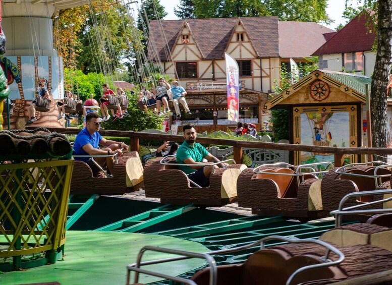 A wooden boat ride with passengers. 5