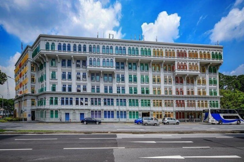 A multi-story building with colorful facades and large windows. 4