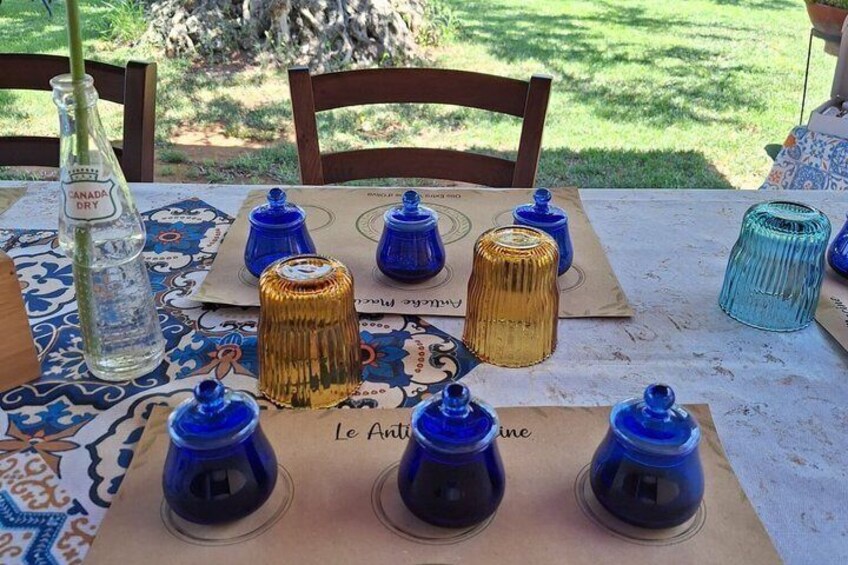 A table with decorative jars and a bottle. 4