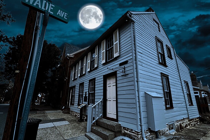 A two-story house with a moon in the sky. 3