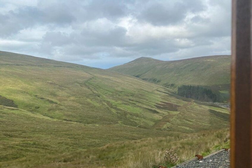 A hilly landscape with a winding path. 3