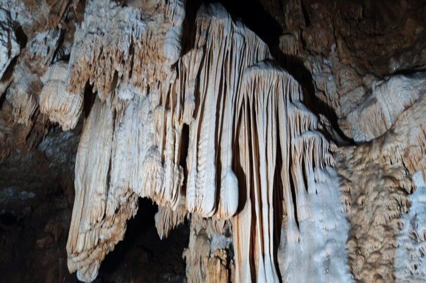 A cave with stalactites and stalagmites. 3
