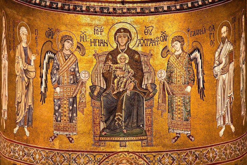 A mosaic with a central figure holding a child, flanked by two angels, all set against a golden background. 5
