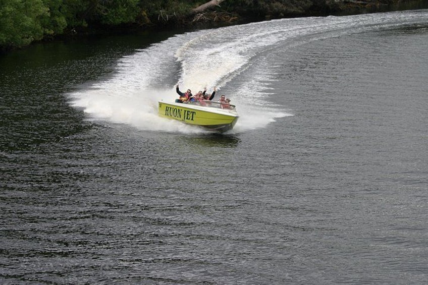 A speedboat named 'HUON JET' on water. 4