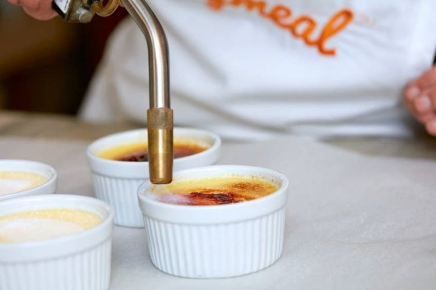 Ramekins with crème brûlée on a table. 2