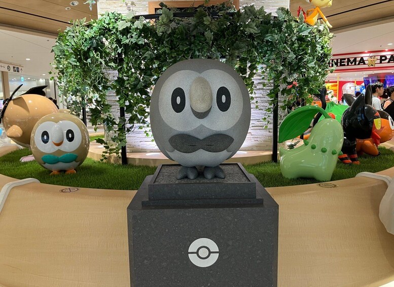 A large owl statue with a mustache in a shopping mall. 5