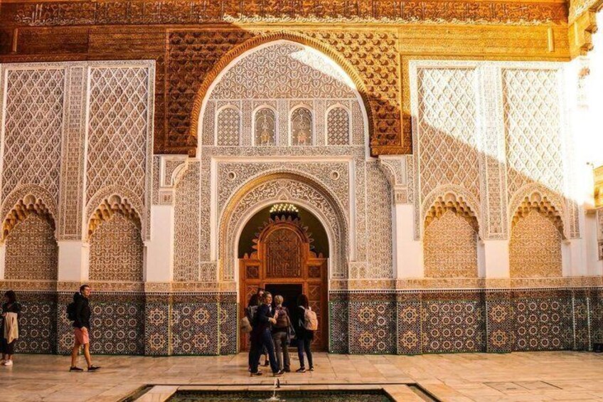 A historic building with intricate tile work and arches. 2