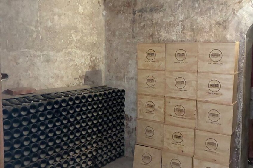 Stacks of cylindrical objects and wooden boxes with logos. 4