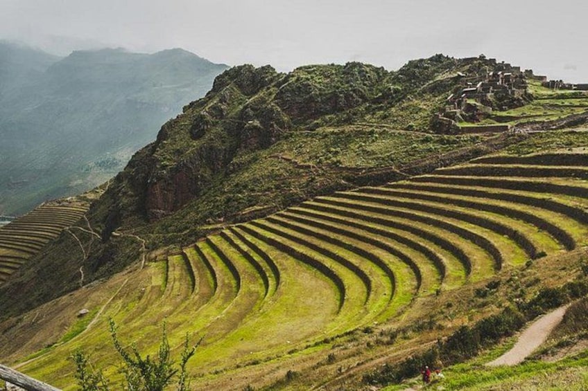 Terraced agricultural fields, a winding path, and a mountainous landscape. 2