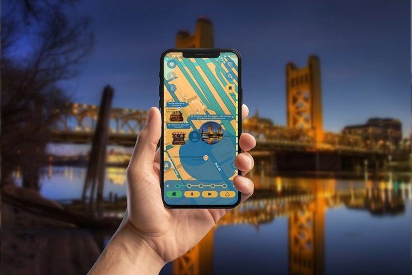 A hand holding a smartphone displaying a map with a bridge and buildings in the background. 4