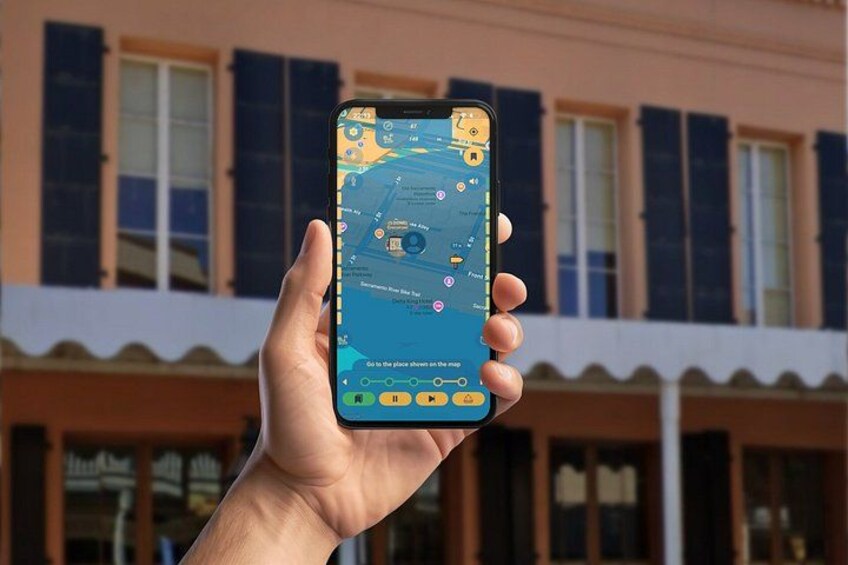 A hand holding a smartphone displaying a map with various location markers. 2