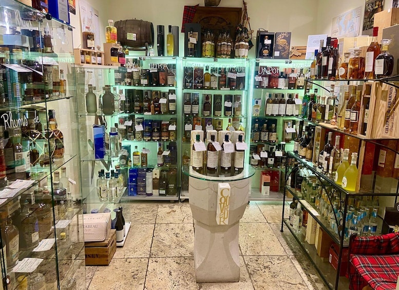 A liquor store with shelves of bottles and boxes. 5
