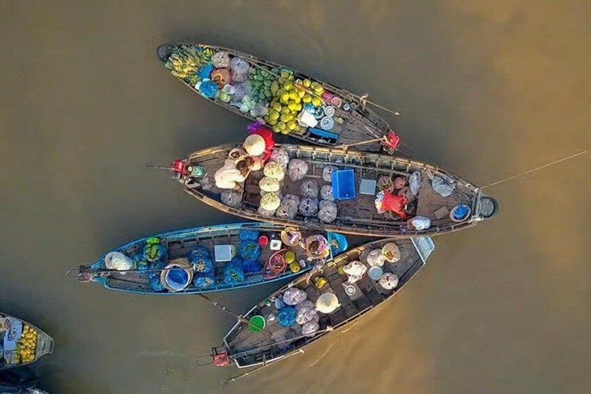 A group of boats docked in a body of water. 1