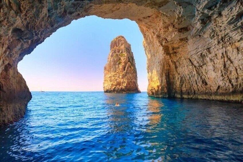 A natural rock formation with a clear waterway. 4