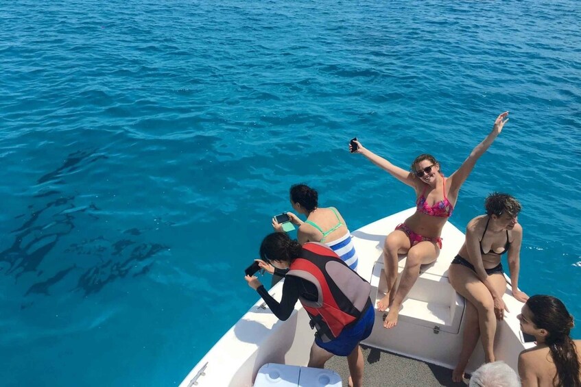 A group of people on a boat in a body of water. 3